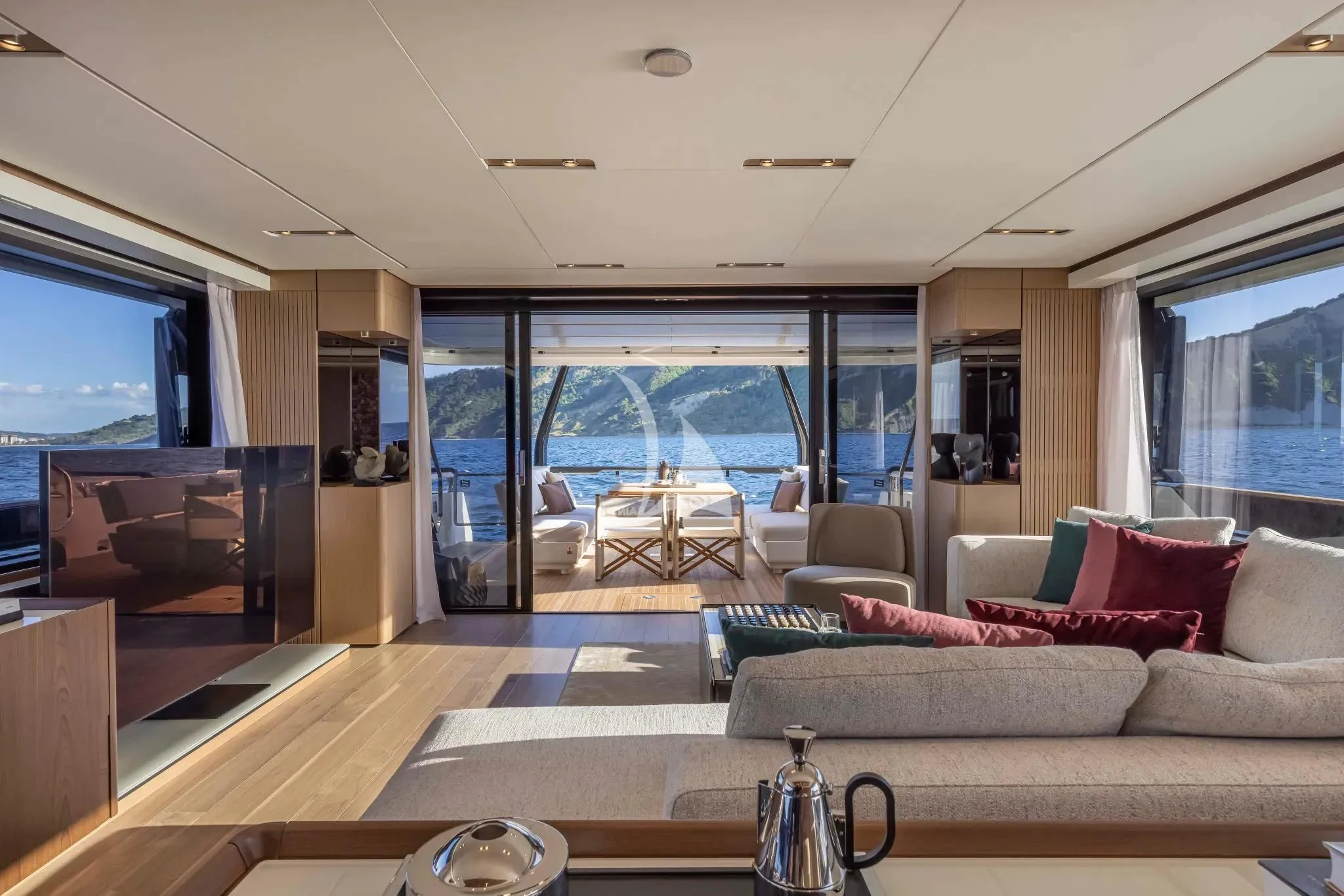 a living room with a large glass window aboard SPICA Yacht for Sale
