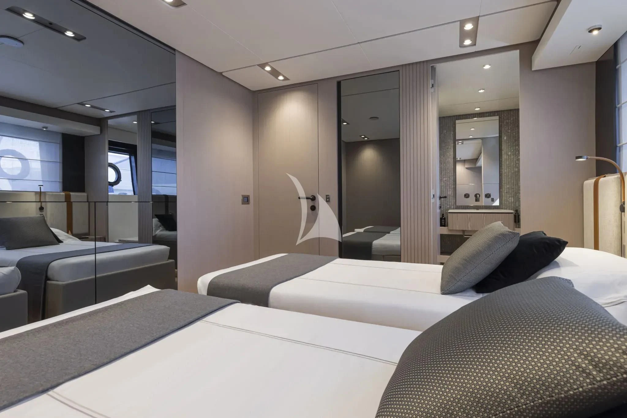 a room with a bed and a couch aboard SPICA Yacht for Sale