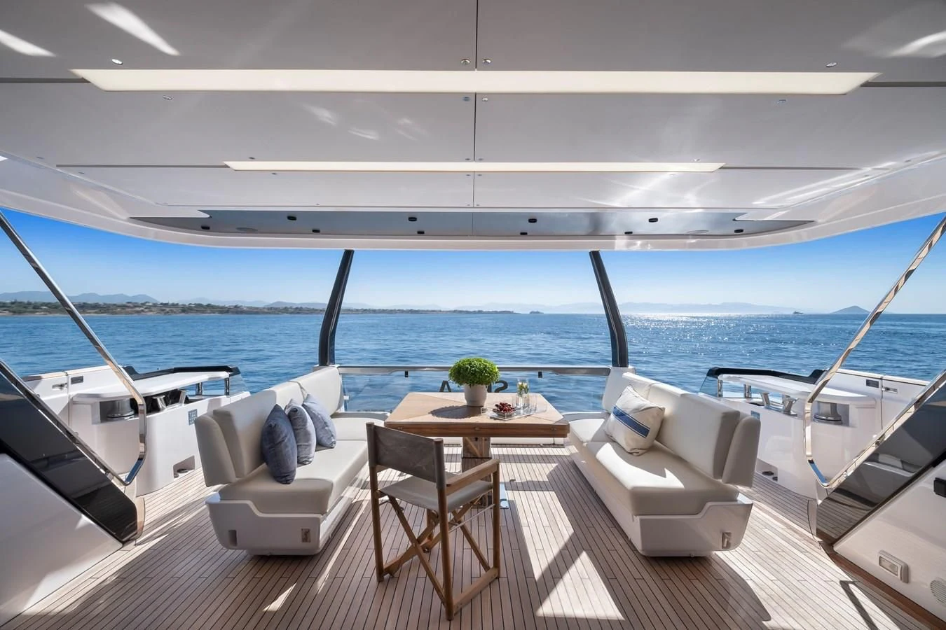 a room with a table and chairs on a boat aboard SPICA Yacht for Sale