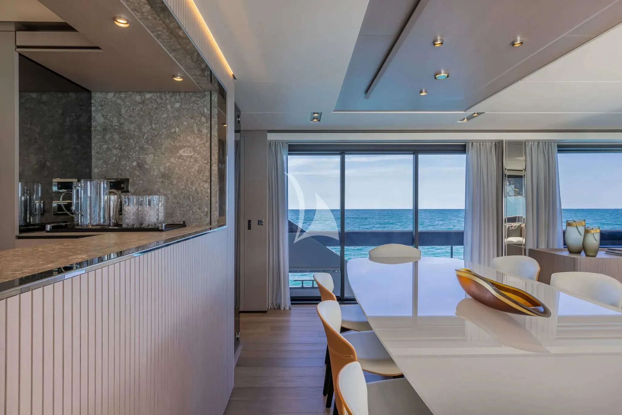 a kitchen with a table and chairs aboard SPICA Yacht for Sale