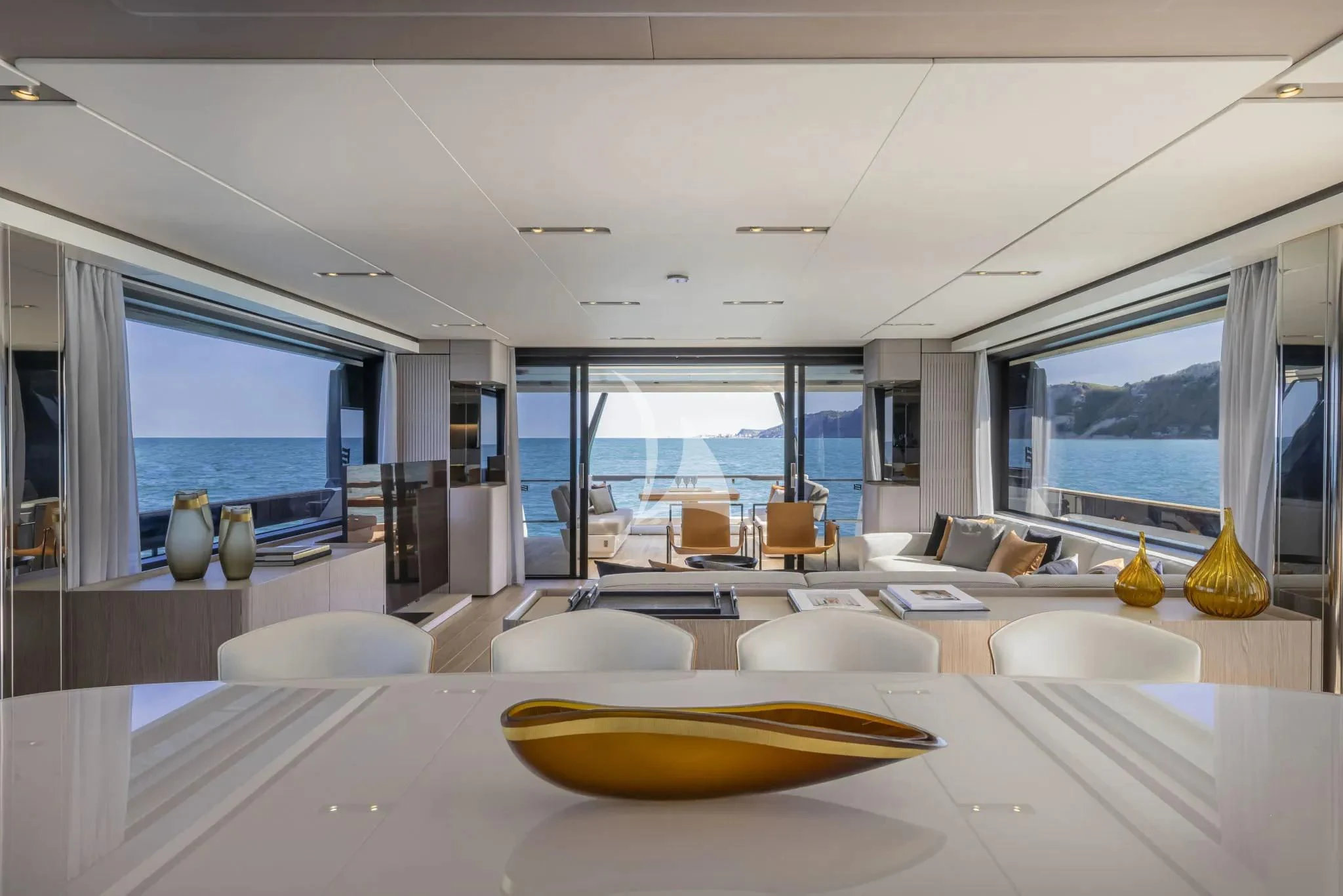 a large modern looking room with a large open window aboard SPICA Yacht for Sale