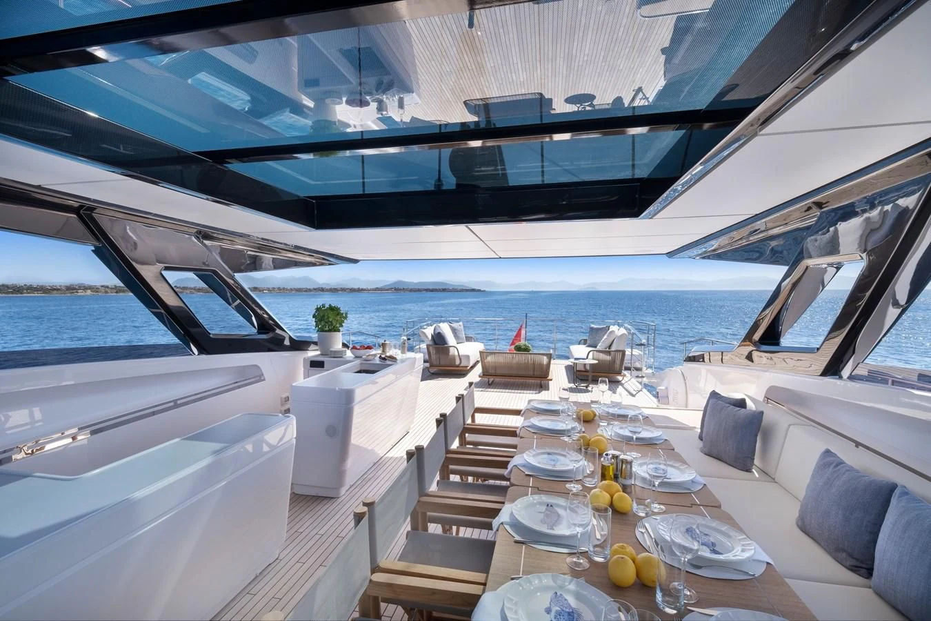 a boat with tables and chairs aboard SPICA Yacht for Sale