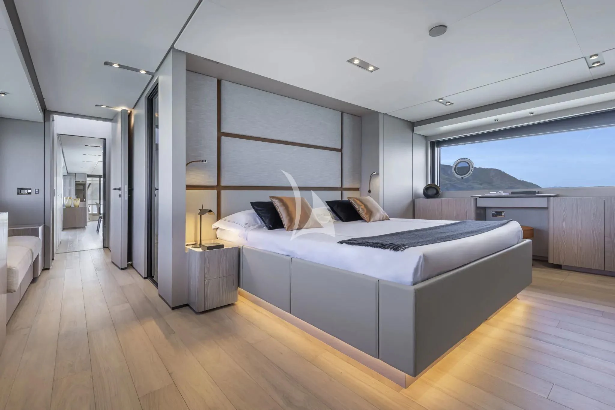a bedroom with a large bed aboard SPICA Yacht for Sale