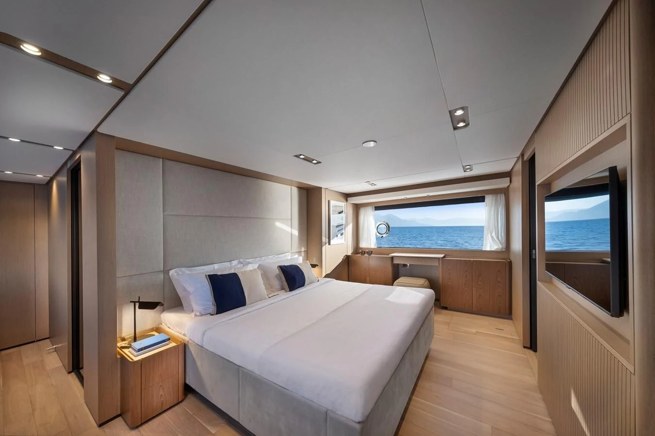 a bedroom with a large bed aboard SPICA Yacht for Sale