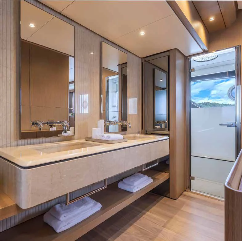 a bathroom with a large mirror aboard SPICA Yacht for Sale