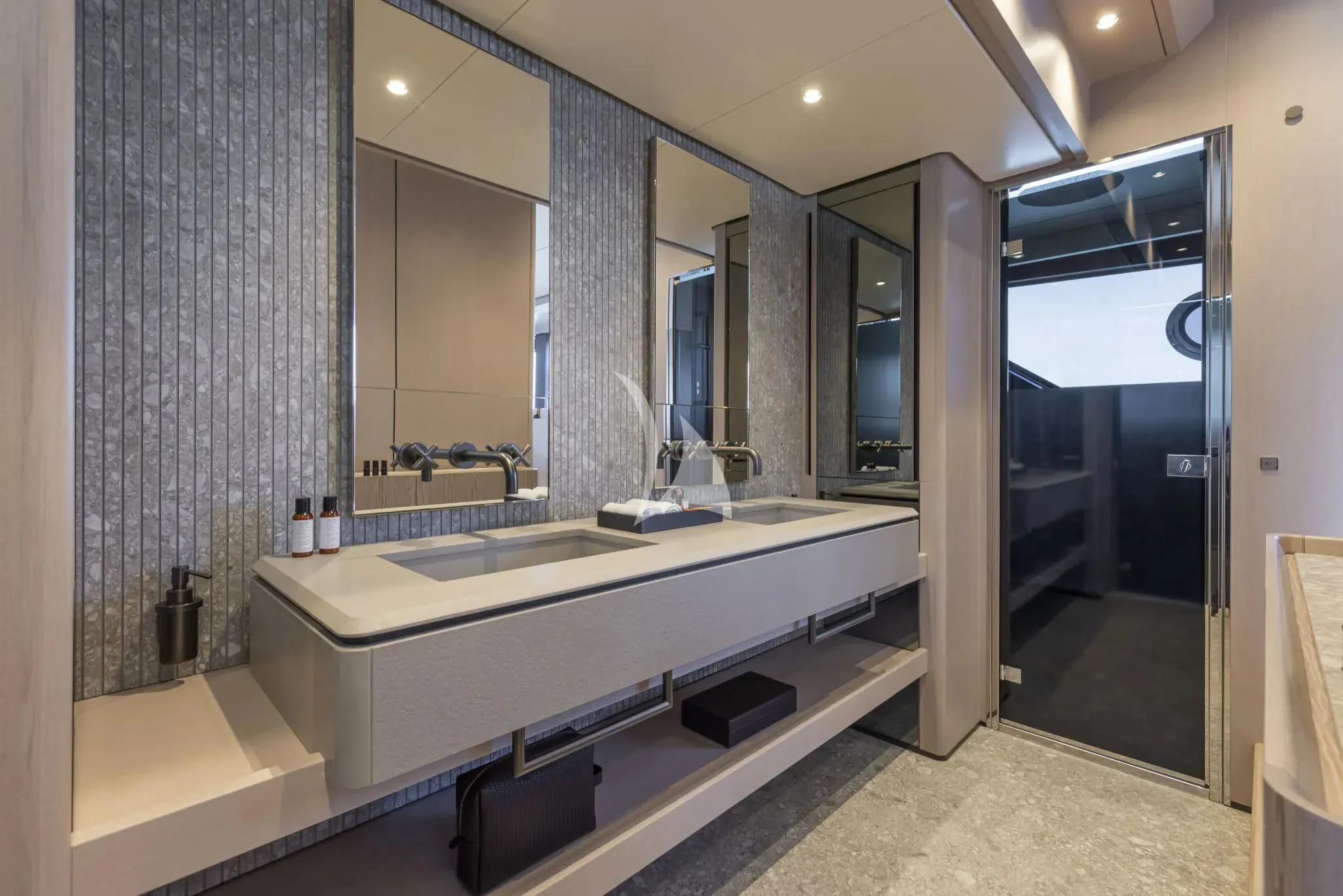 a bathroom with a large mirror aboard SPICA Yacht for Sale