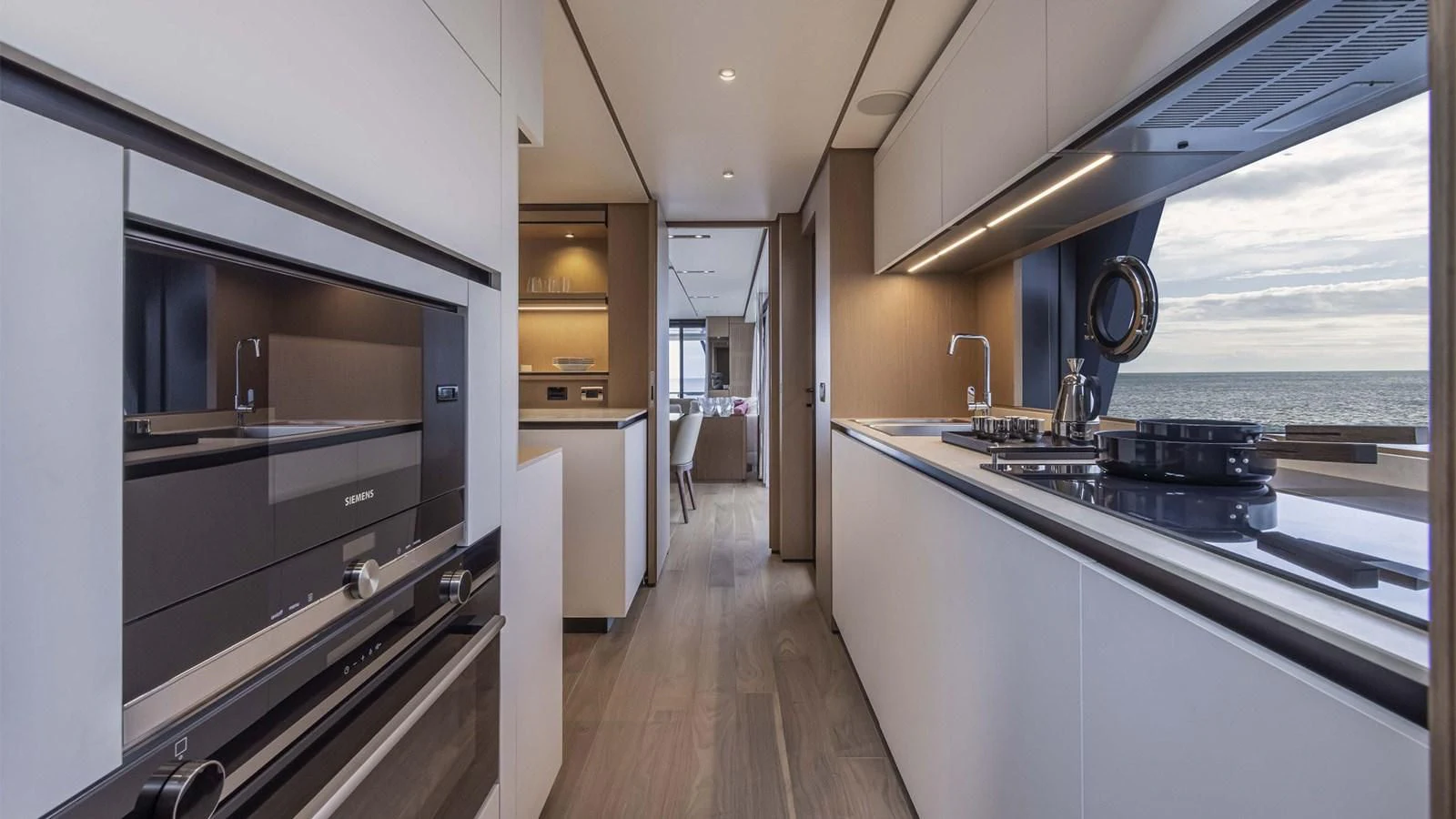a kitchen with a large window aboard SPICA Yacht for Sale