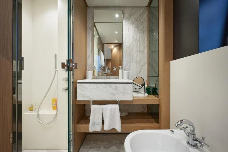 a bathroom with a sink and a mirror aboard SPICA Yacht for Sale