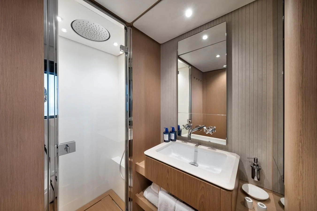 a bathroom with a sink and a shower aboard SPICA Yacht for Sale