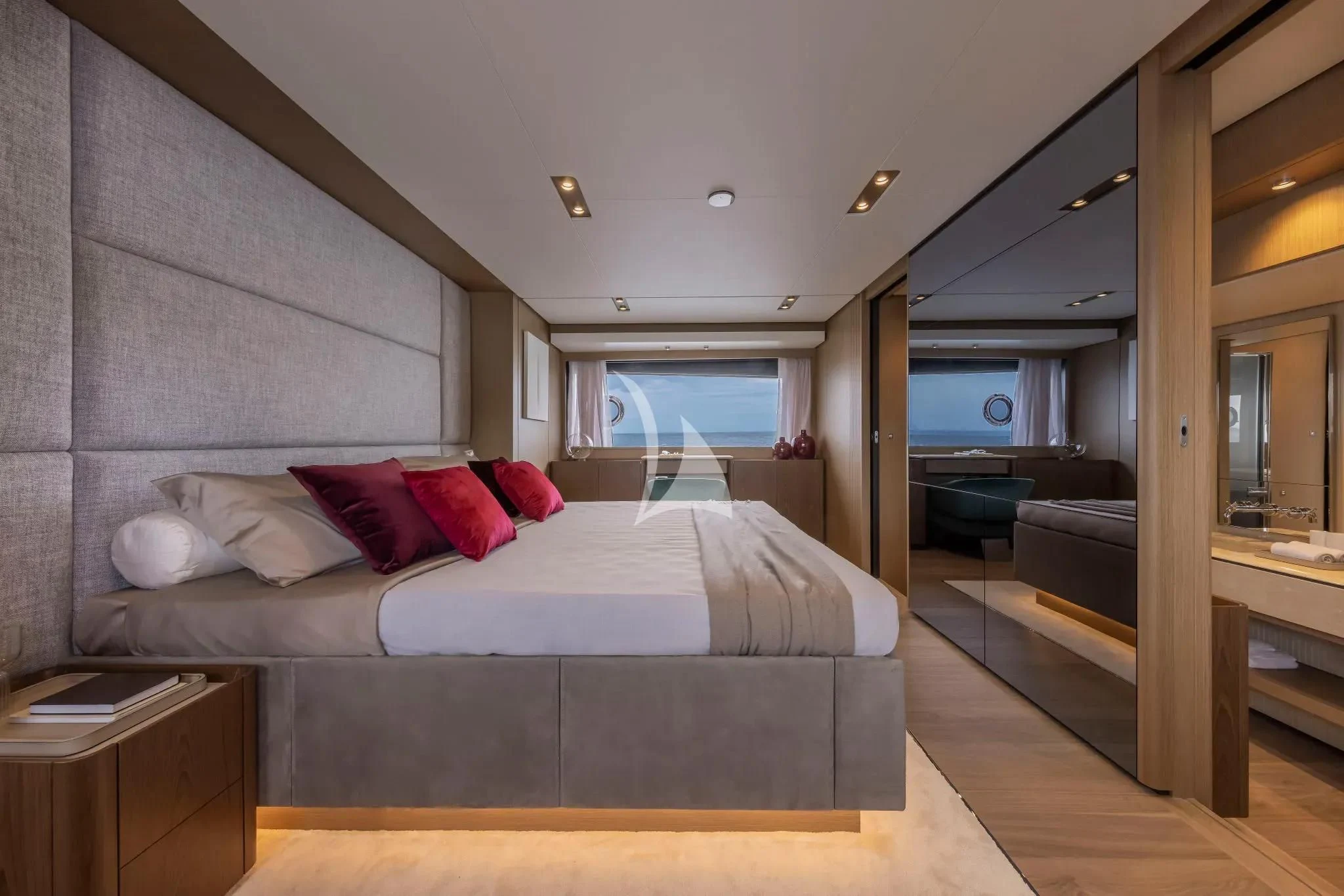 a large bed in a room aboard SPICA Yacht for Sale