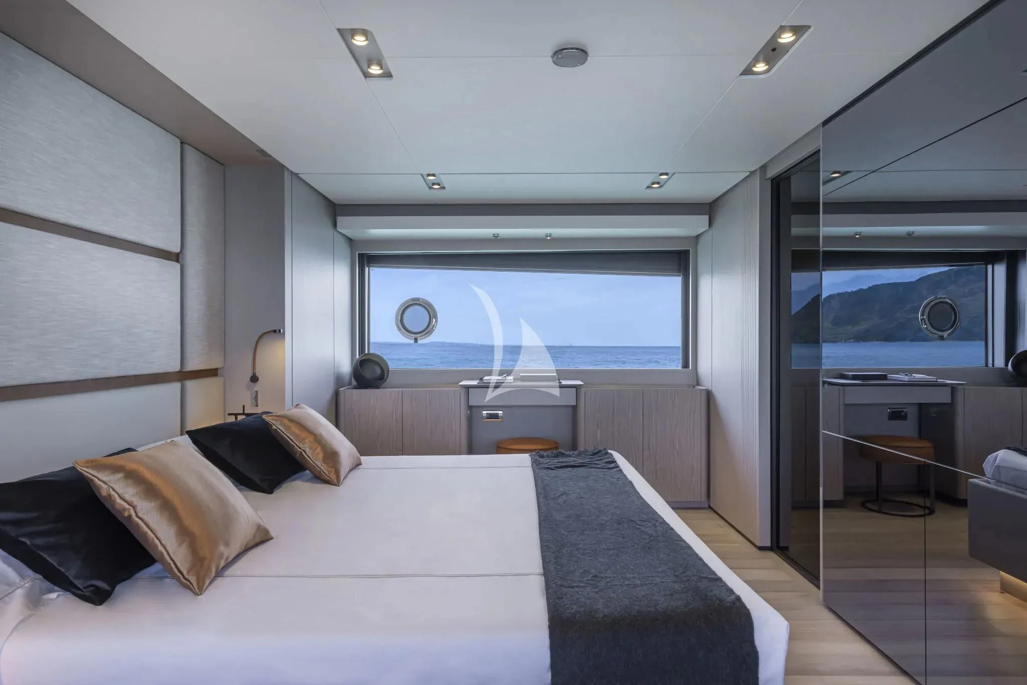 a large bed in a room aboard SPICA Yacht for Sale