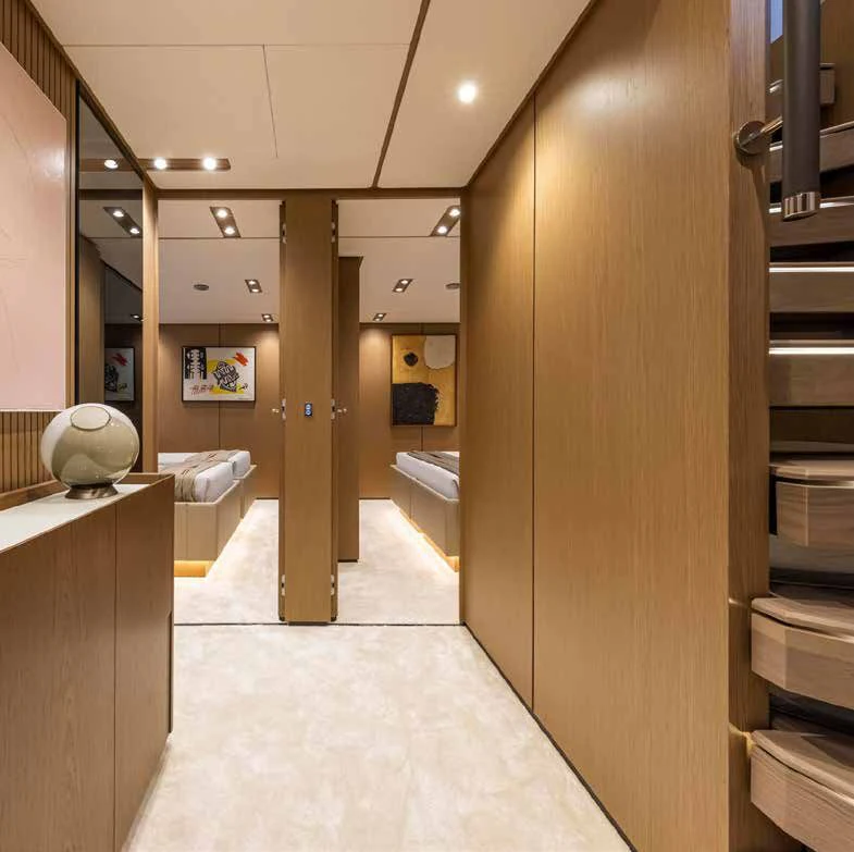 a hallway with a large mirror aboard SPICA Yacht for Sale