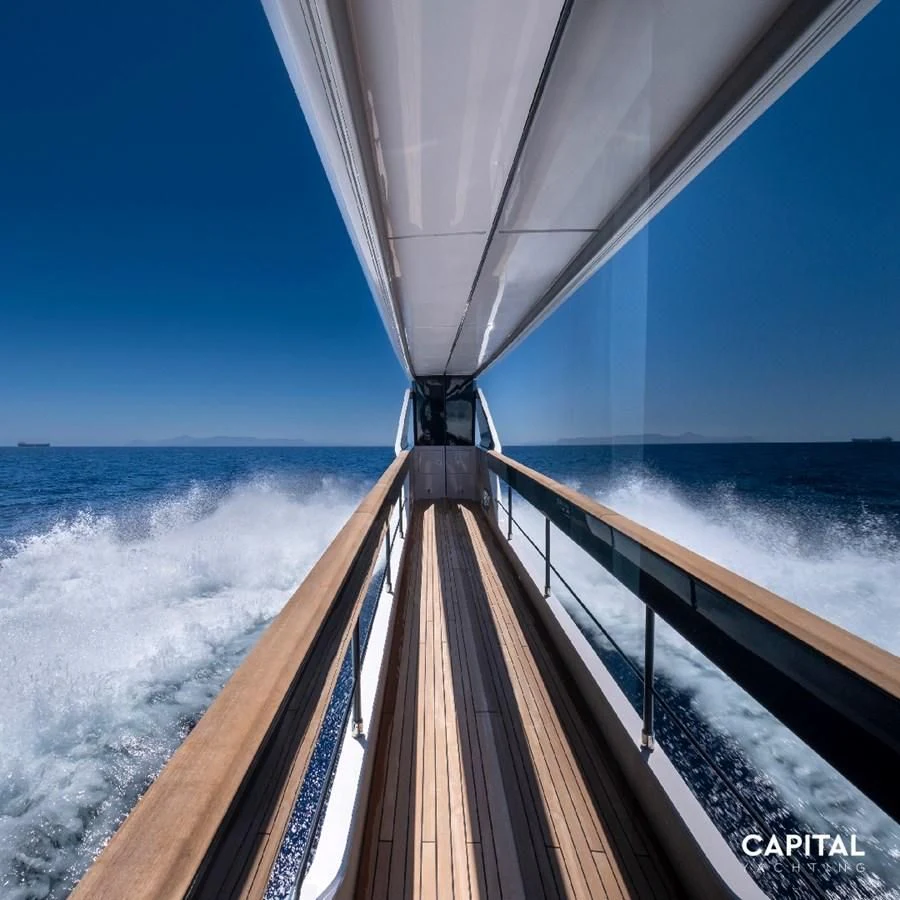 a long wooden bridge over water aboard SPICA Yacht for Sale