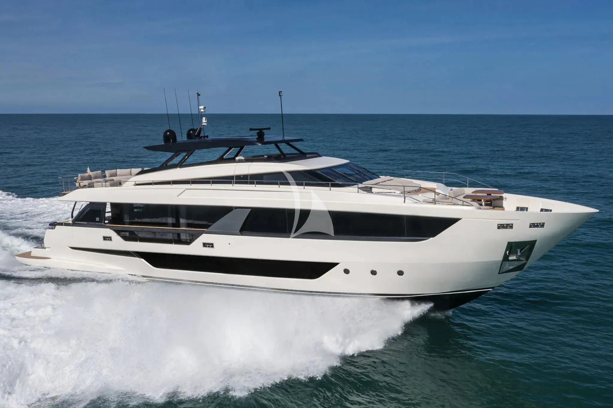 a white yacht on the water aboard SPICA Yacht for Sale