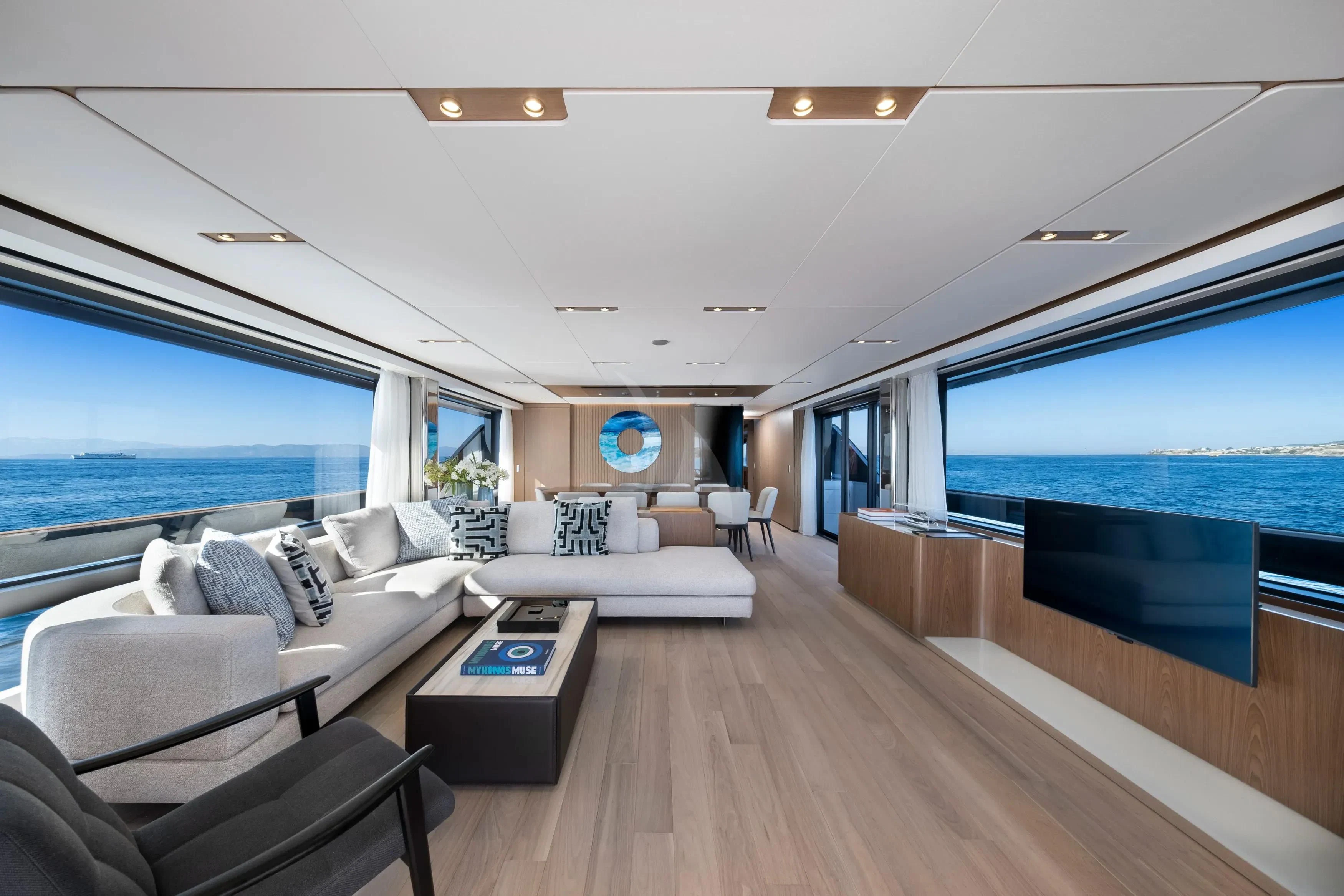 a living room with a large window aboard SPICA Yacht for Sale