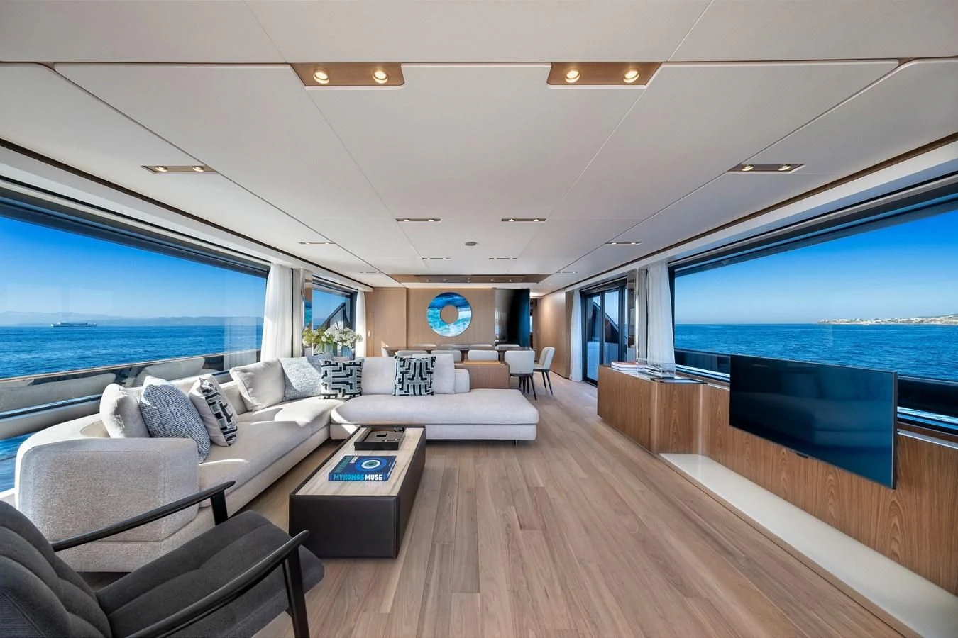 a living room with a large window aboard SPICA Yacht for Sale