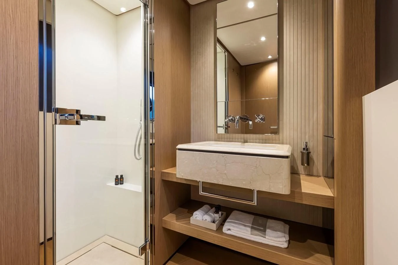 a bathroom with a large mirror aboard SPICA Yacht for Sale