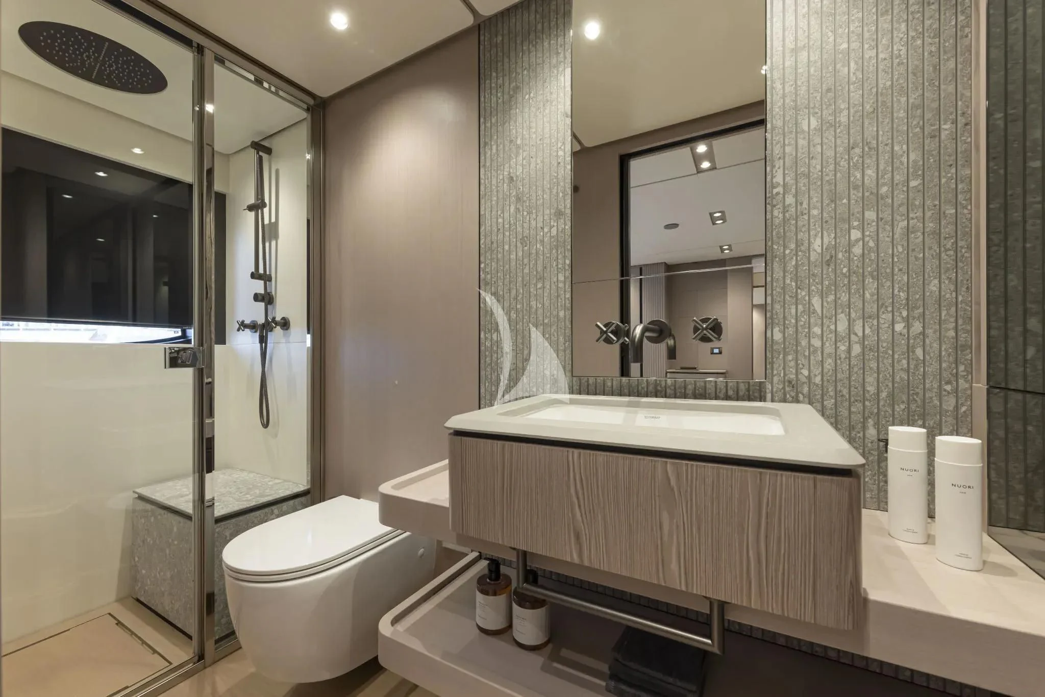 a bathroom with a tub sink and toilet aboard SPICA Yacht for Sale