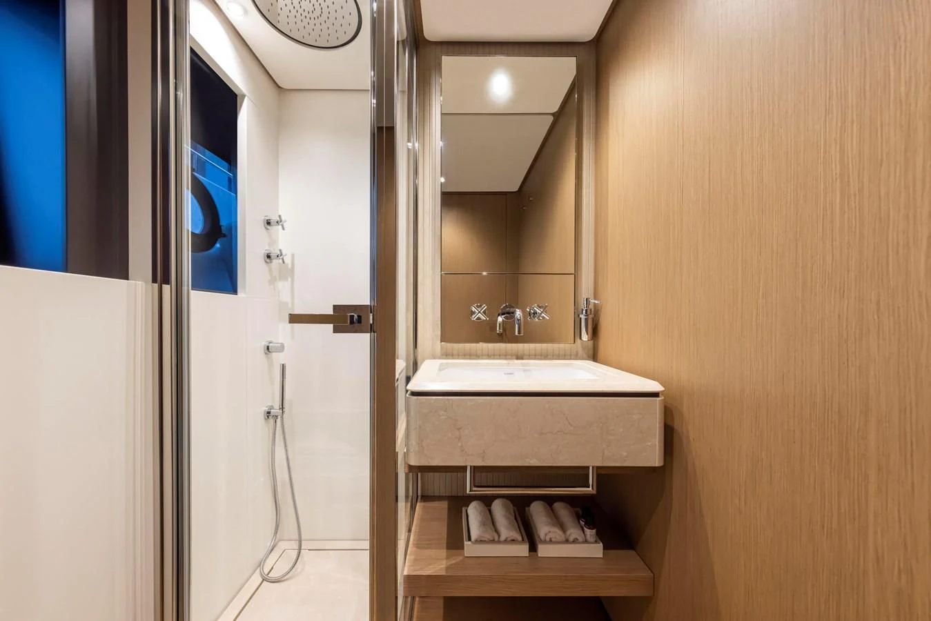 a bathroom with a sink and a mirror aboard SPICA Yacht for Sale