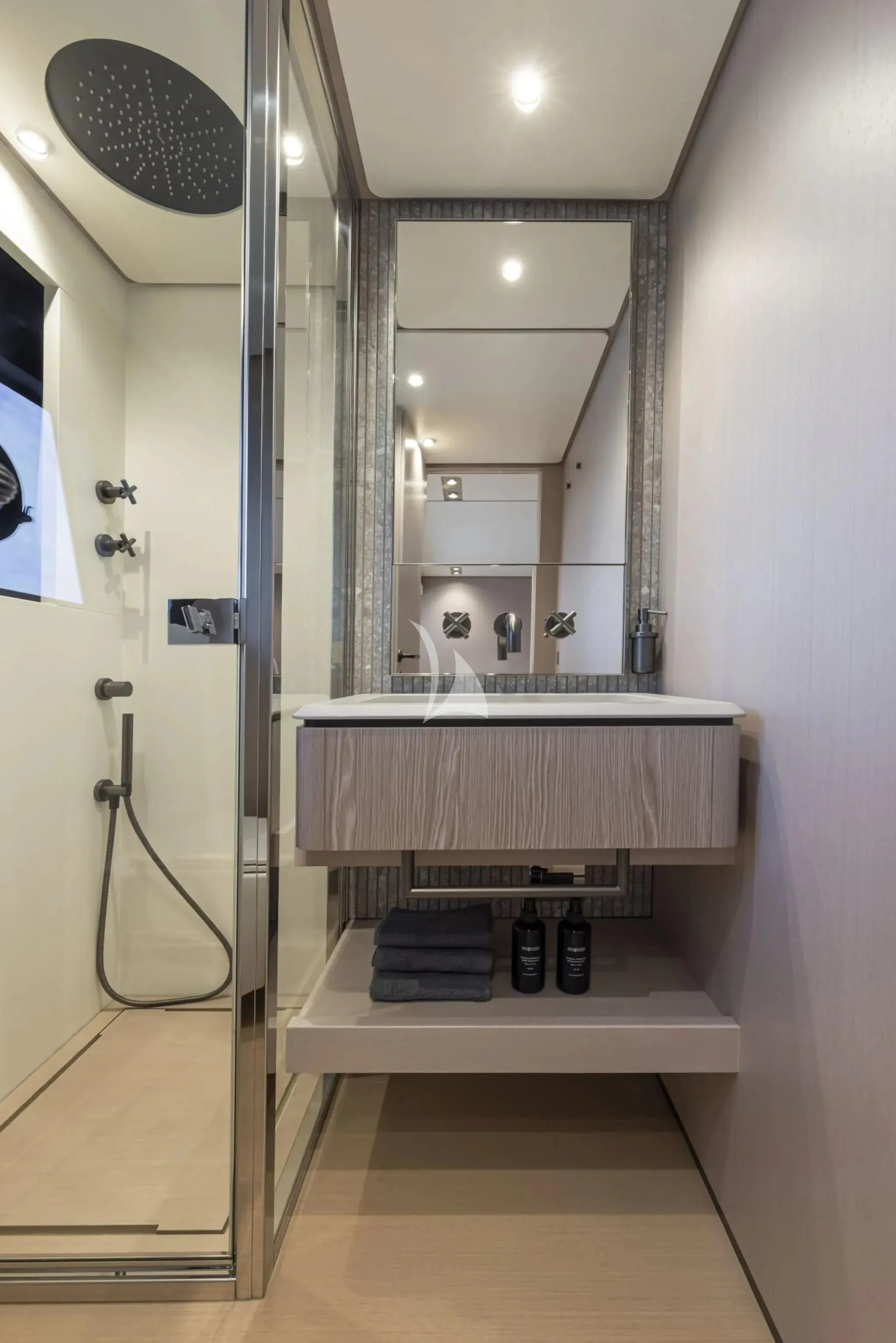 a bathroom with a sink and a mirror aboard SPICA Yacht for Sale