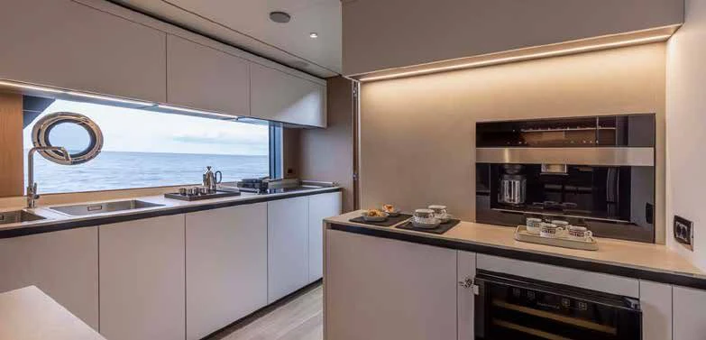 a kitchen with a stove and a sink aboard SPICA Yacht for Sale