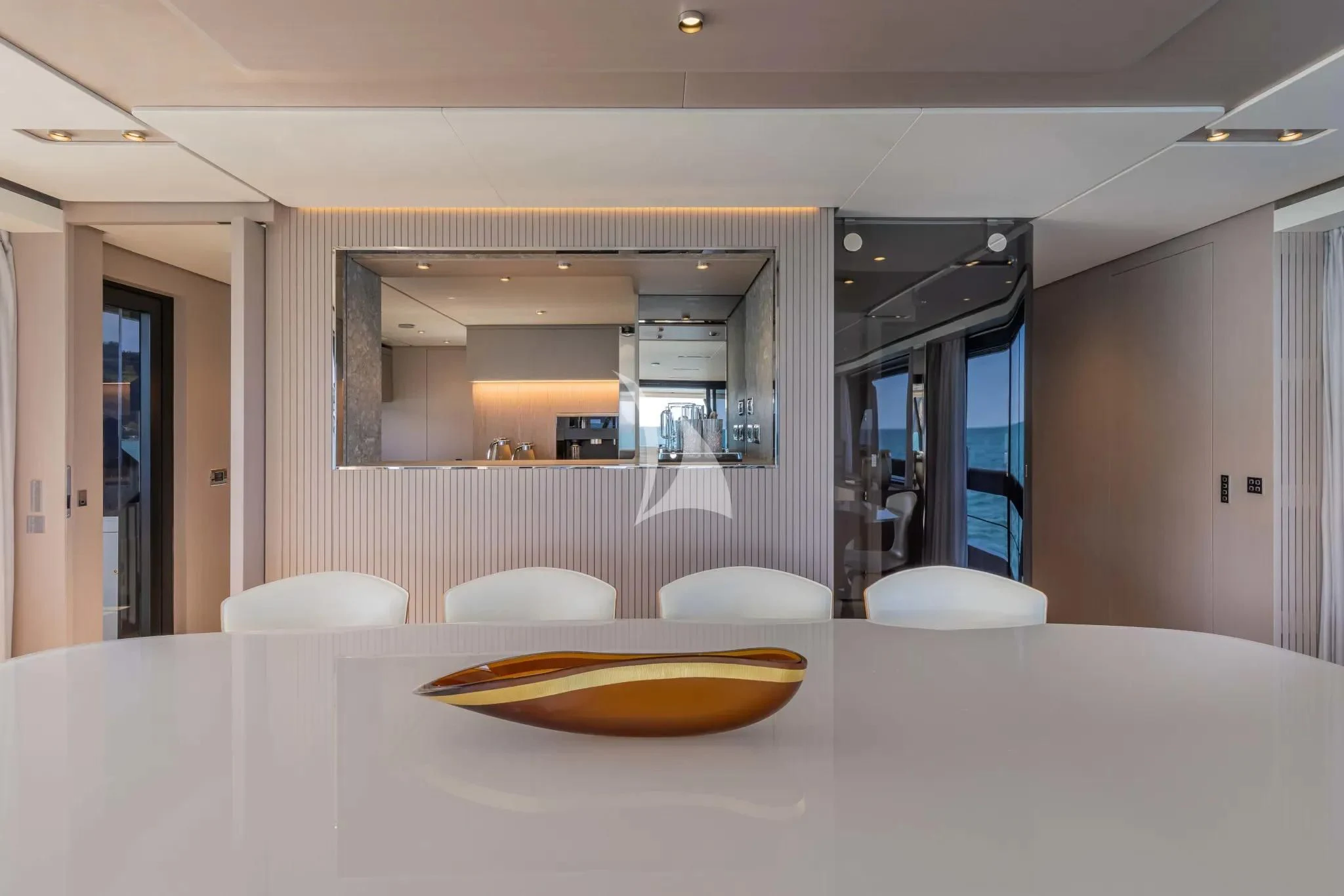 a room with tables and chairs aboard SPICA Yacht for Sale