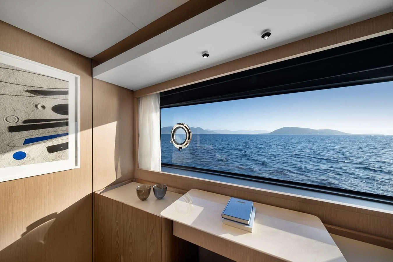 a room with a bed and a window aboard SPICA Yacht for Sale