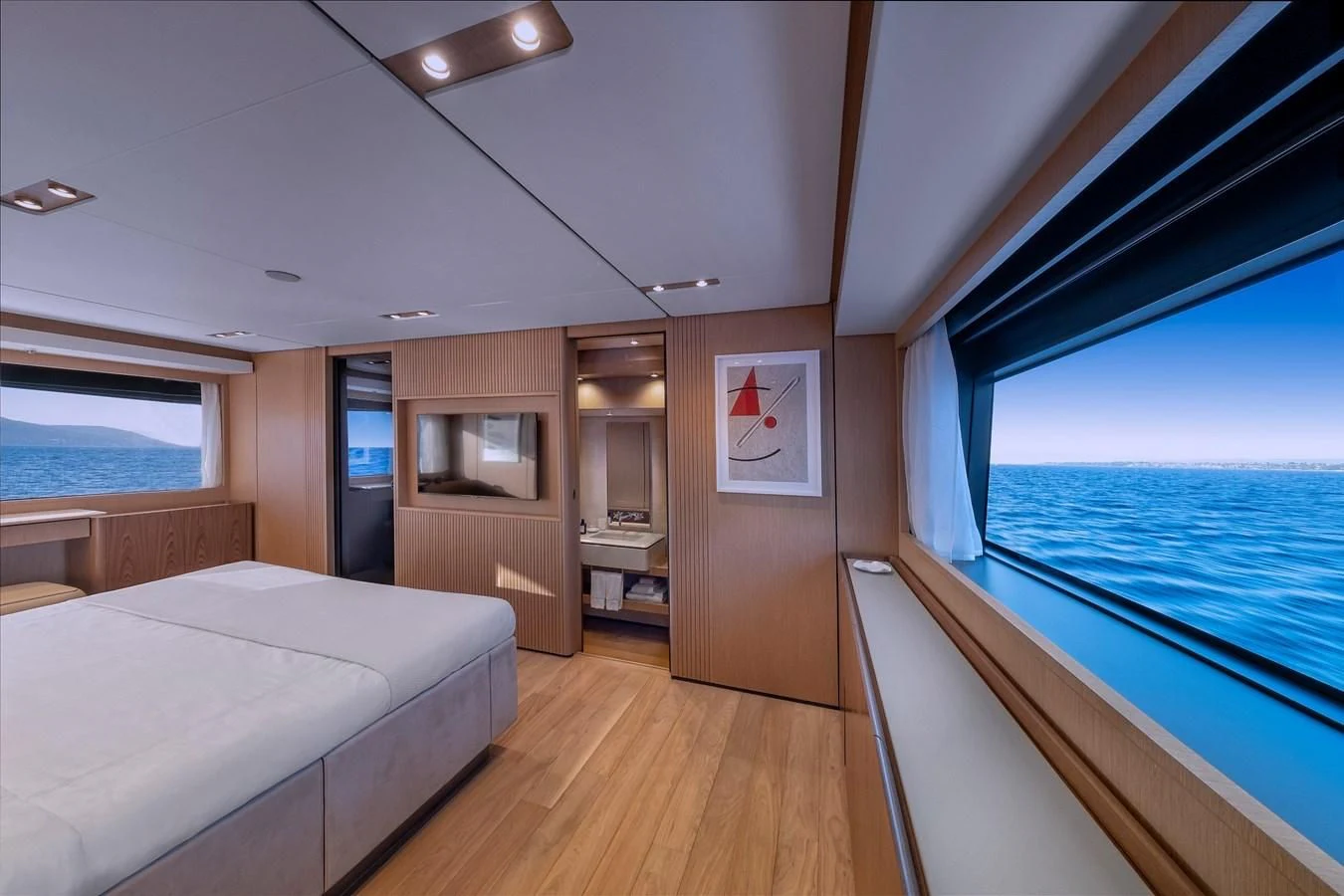 a room with a bed and a window aboard SPICA Yacht for Sale