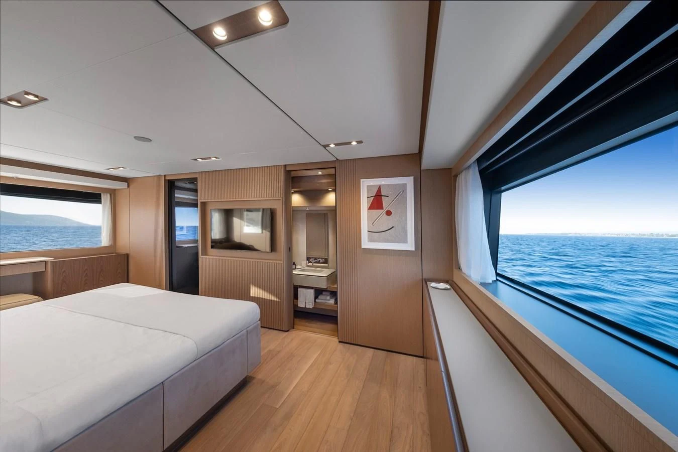 a room with a bed and a window aboard SPICA Yacht for Sale