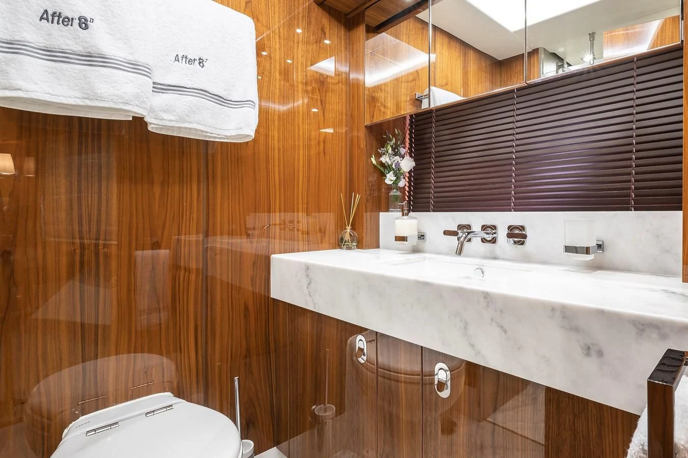 a kitchen with a sink and cabinets aboard AFTER 8 II Yacht for Sale
