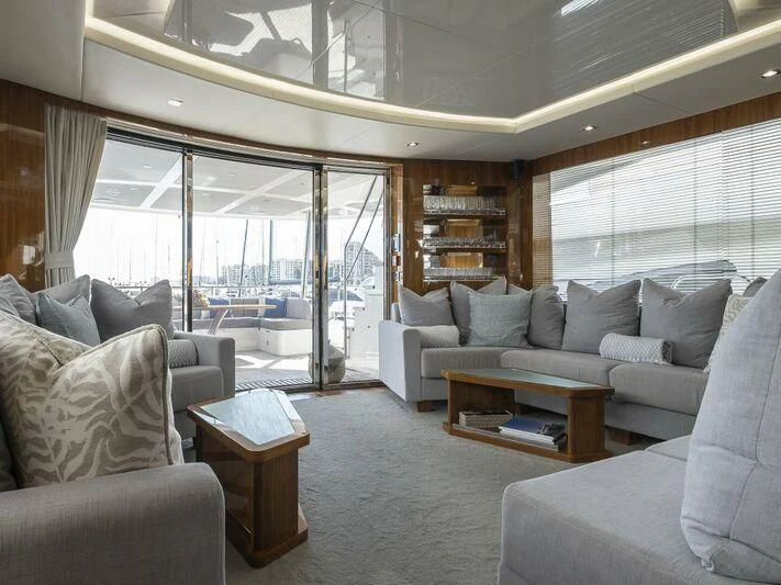 a living room with a large window aboard AFTER 8 II Yacht for Sale