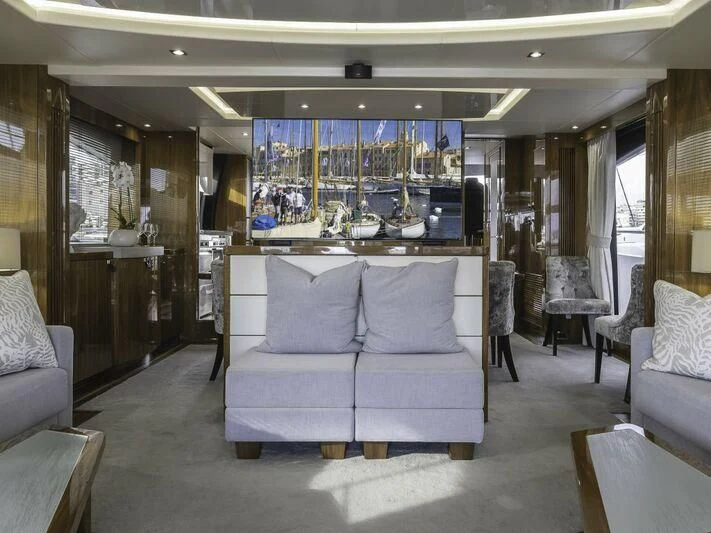 a room with a couch and a television aboard AFTER 8 II Yacht for Sale