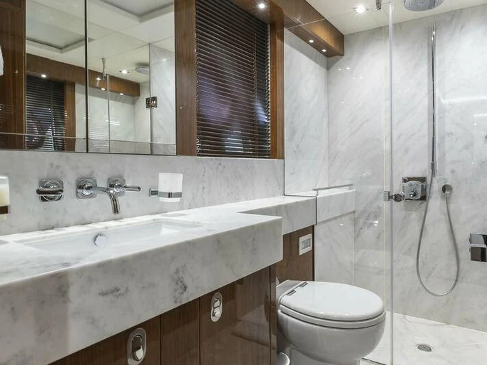 a bathroom with a sink toilet and a shower aboard AFTER 8 II Yacht for Sale