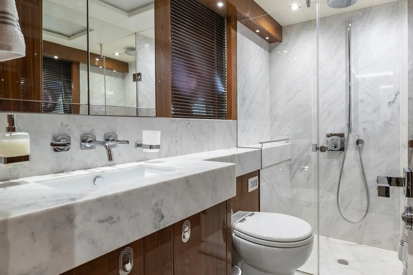 a bathroom with a glass shower aboard AFTER 8 II Yacht for Sale