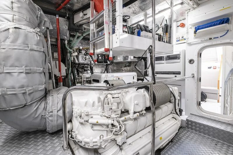 a large white machine with a large metal cylinder aboard AFTER 8 II Yacht for Sale