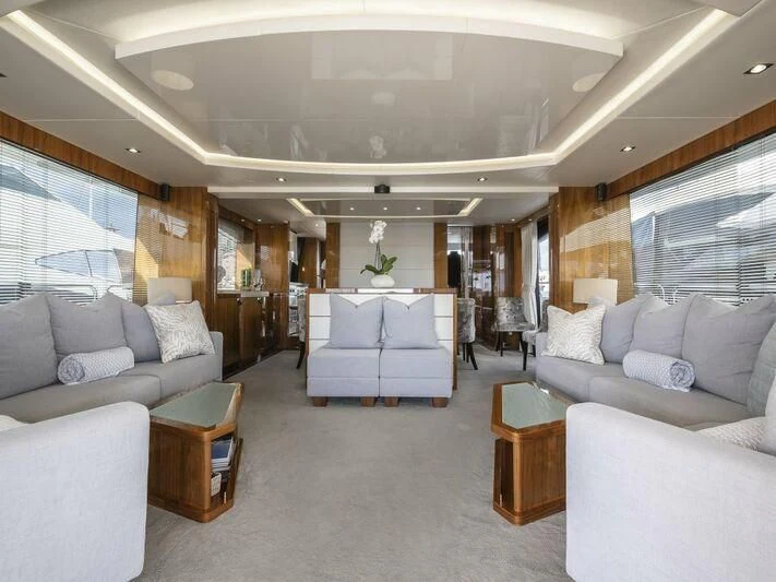 a living room with a couch and a table aboard AFTER 8 II Yacht for Sale