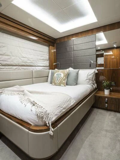 a bed with white sheets aboard AFTER 8 II Yacht for Sale