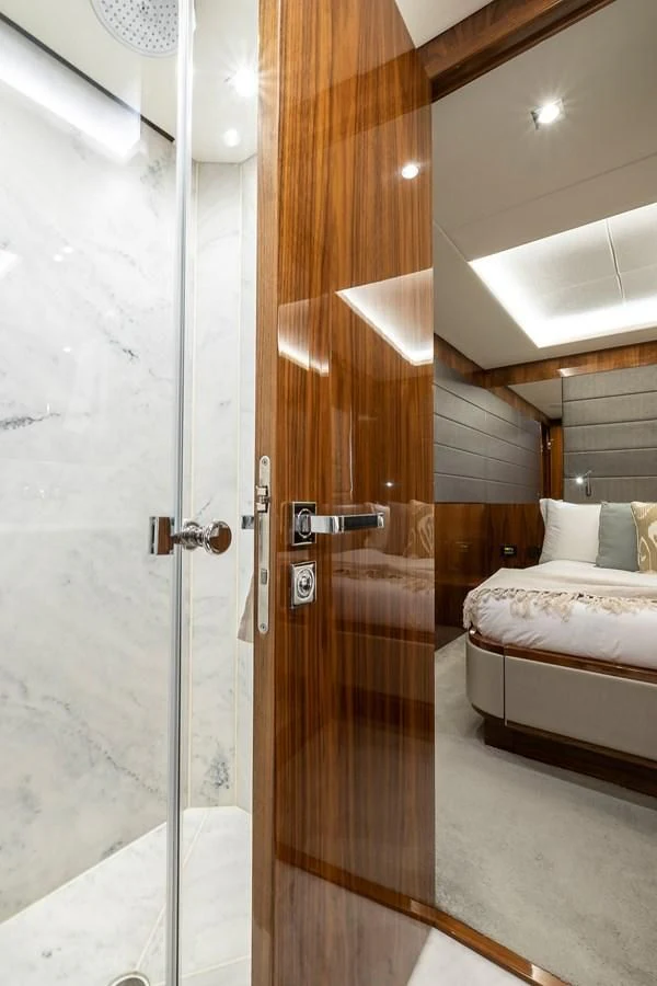 a bathroom with a glass shower door aboard AFTER 8 II Yacht for Sale