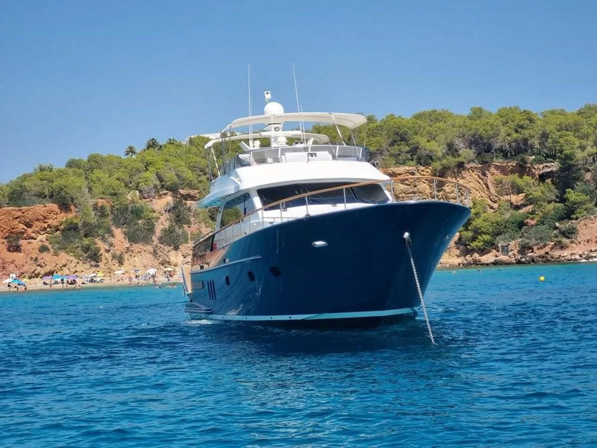 a large white boat in the water aboard PLEIADES Yacht for Sale