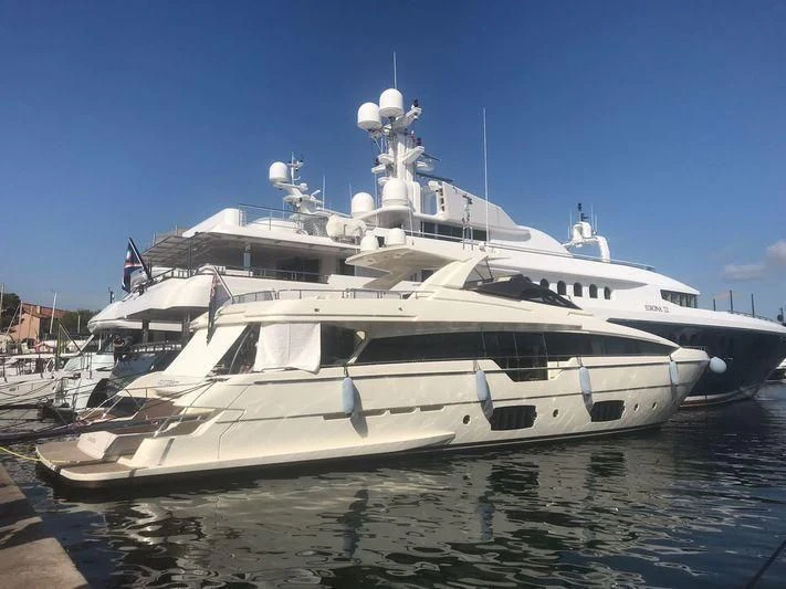 a large white boat in a harbor aboard NO PROBLEM OF LONDON Yacht for Sale