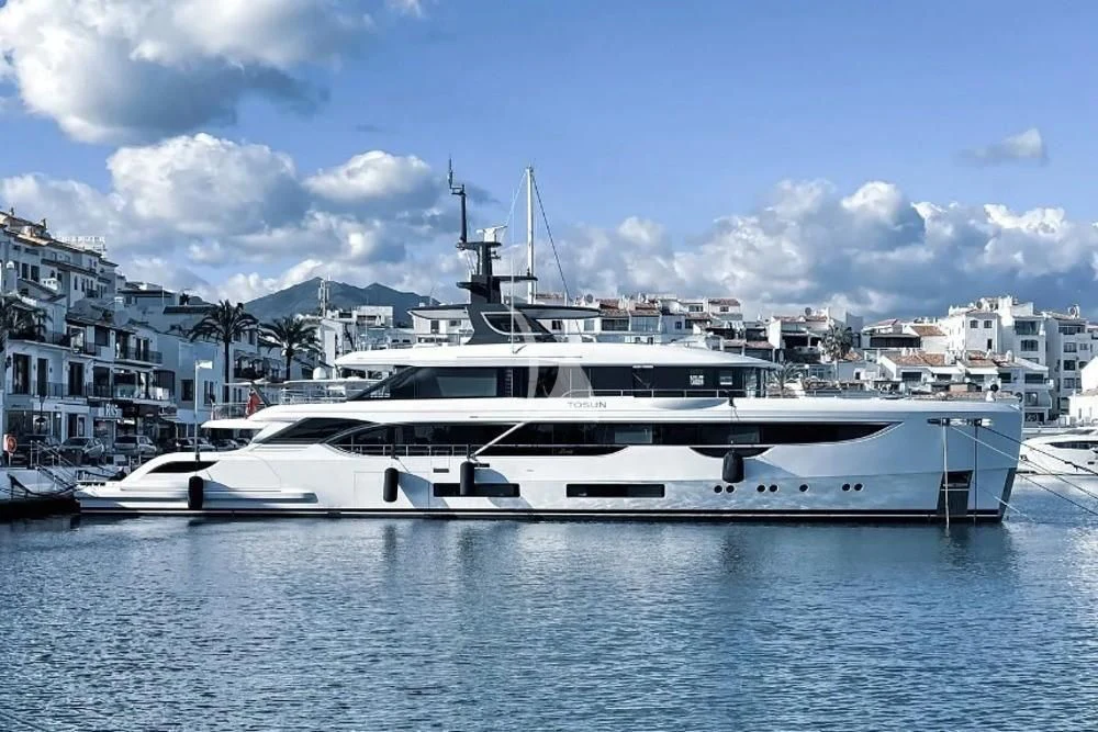 a white yacht in the water aboard TOSUN Yacht for Sale