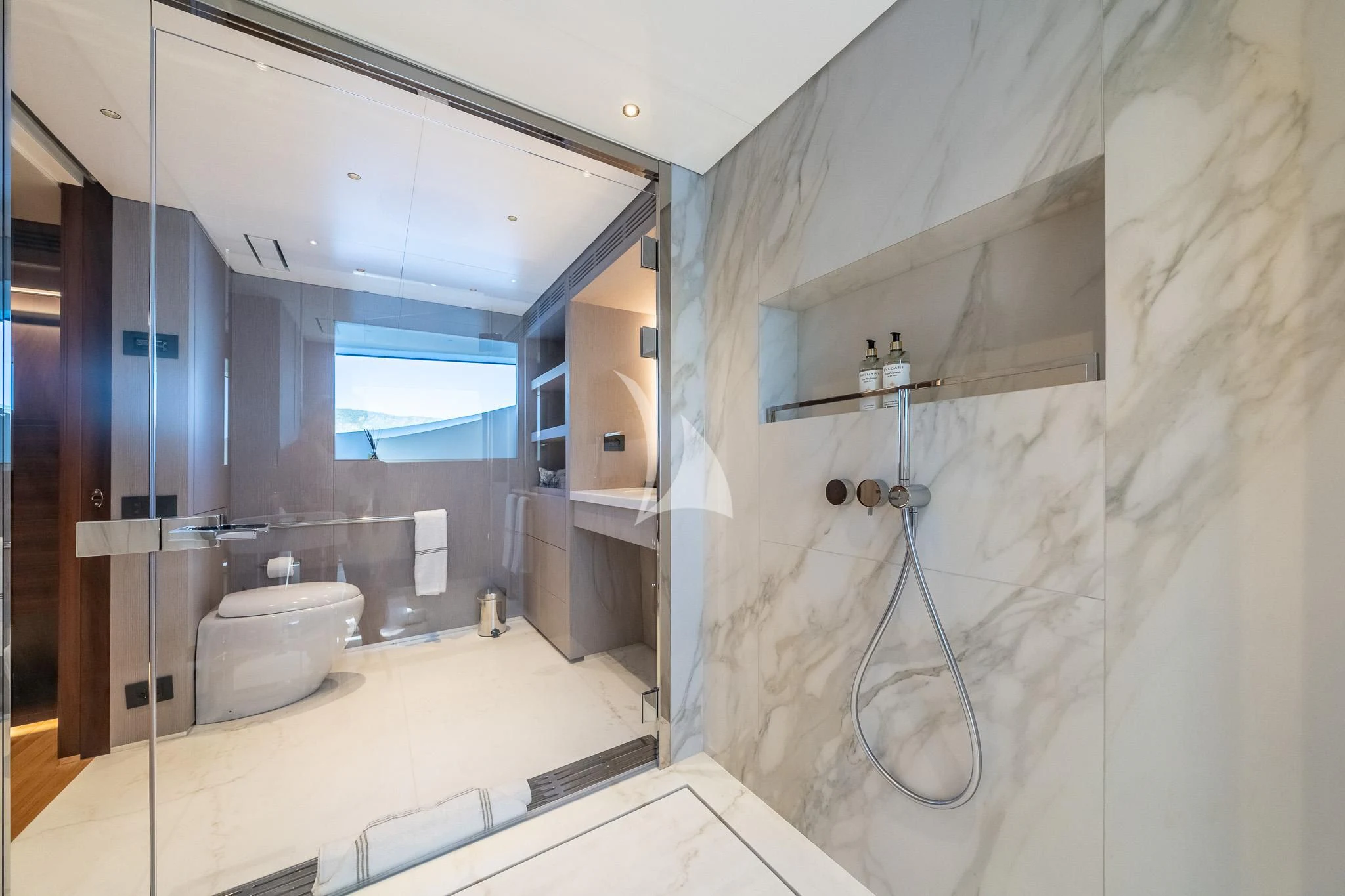 a bathroom with a large mirror aboard TOSUN Yacht for Sale