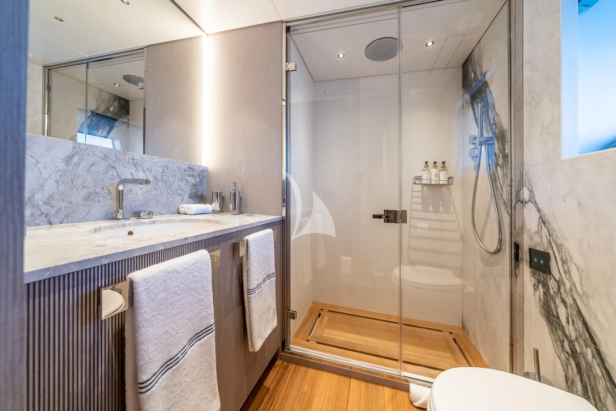 a bathroom with a shower and sink aboard TOSUN Yacht for Sale