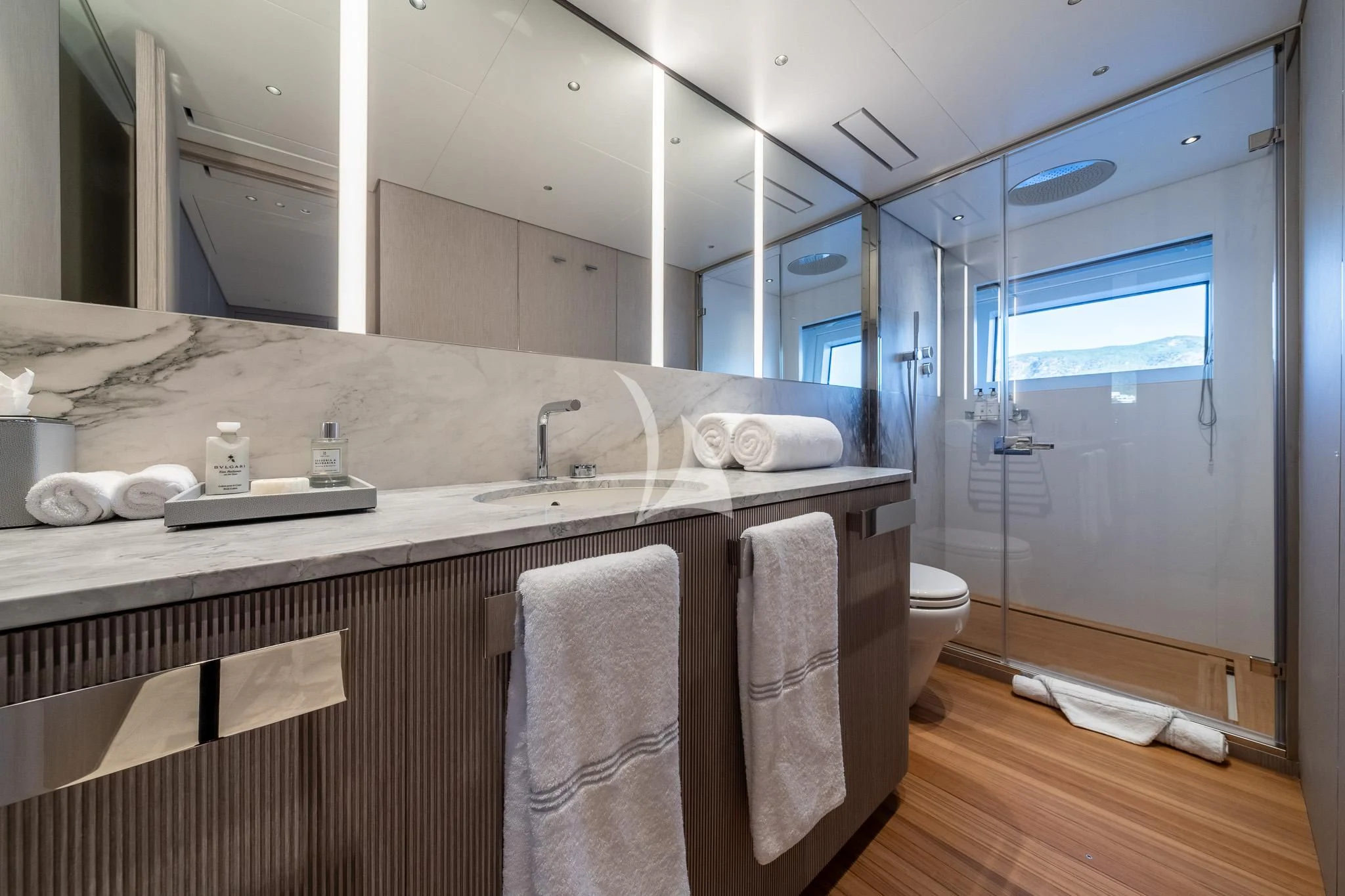 a bathroom with a large mirror aboard TOSUN Yacht for Sale