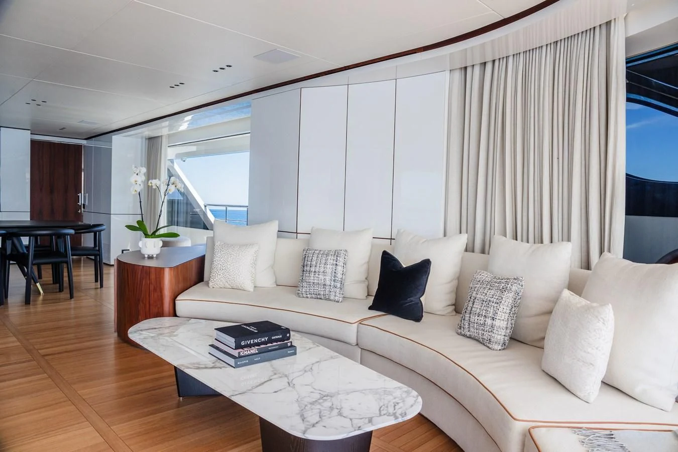 a living room with a white couch aboard TOSUN Yacht for Sale
