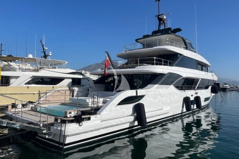 a large white yacht docked aboard TOSUN Yacht for Sale