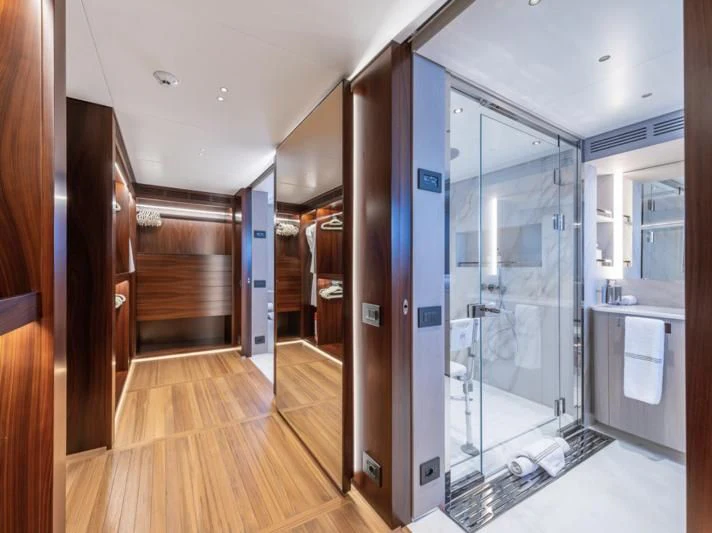 a room with a glass door and a wood floor aboard TOSUN Yacht for Sale