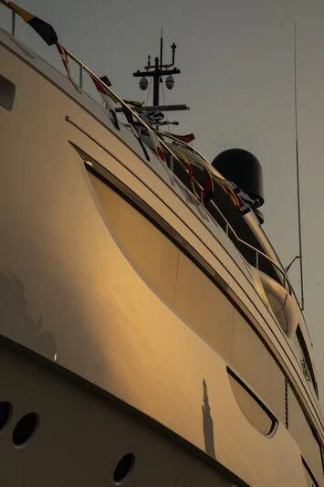 a large white and orange ship aboard TOSUN Yacht for Sale