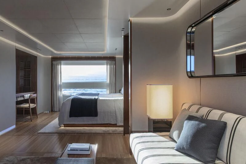 a bedroom with a bed and a desk aboard TOSUN Yacht for Sale
