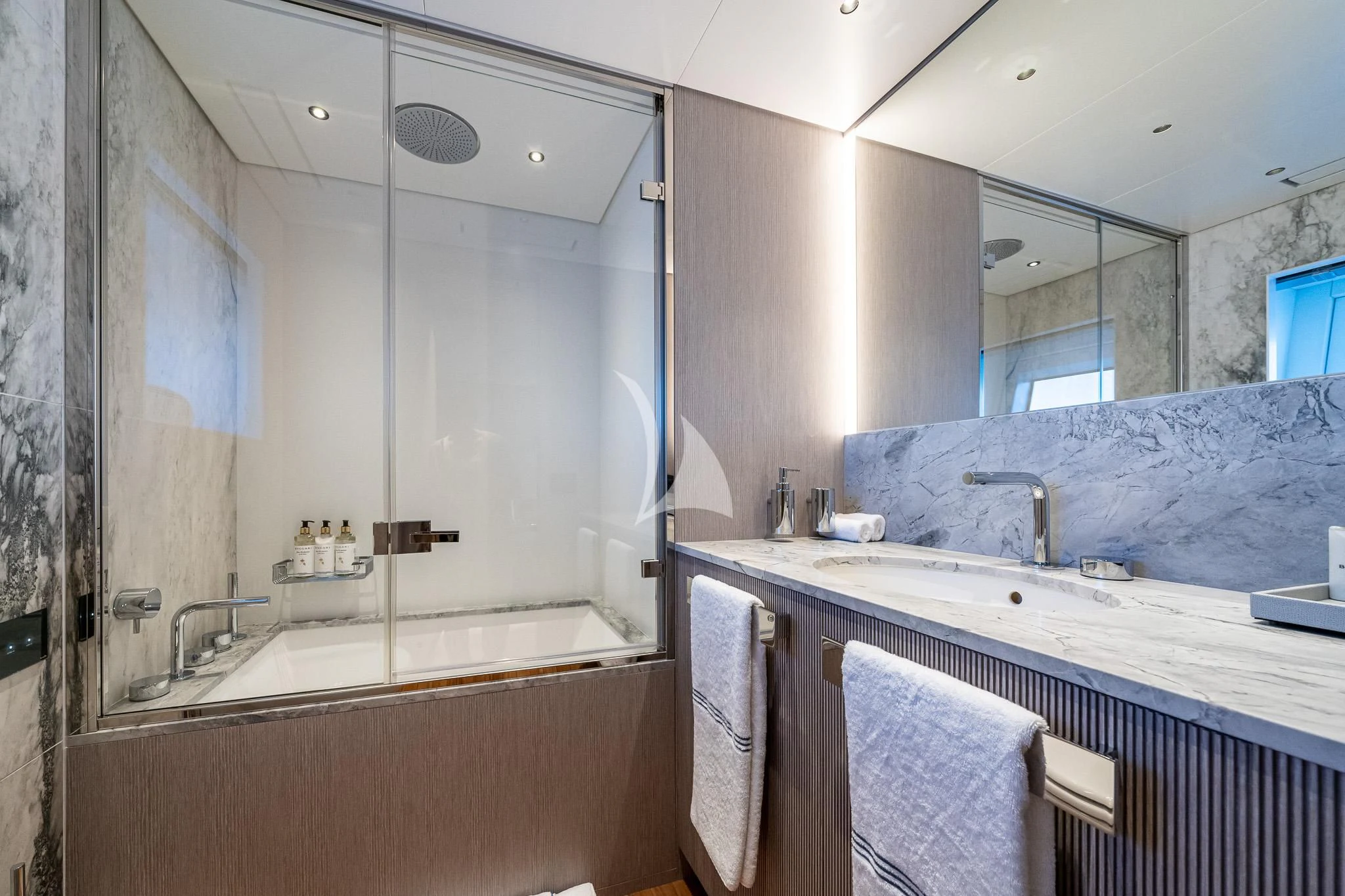 a bathroom with a large mirror aboard TOSUN Yacht for Sale